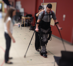 Research participant Kyle Gieni is learning to use the Ekso suit.
