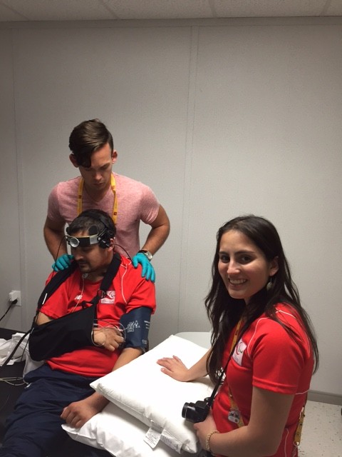 Dr. Phillips performs a sit-up test with a member of the Chilean Wheelchair Rugby team. The clinic was a "phenomenal research success," says Dr. Phillips. The games' organizers welcomed the ICORD team, and 31 athletes were tested–a very large sample for this type of study. 
