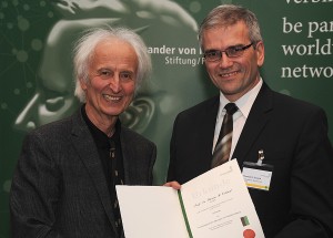 Dr. Oxland is presented with his award
